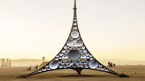 Tower of glass in a desert landscape