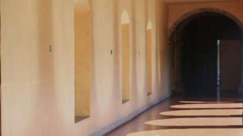 Hallway with arching shadows