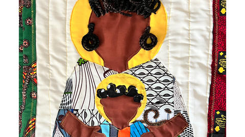 A quilted icon of a mother and child