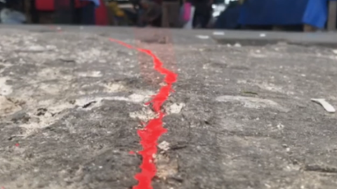Red painted line on a street