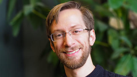 Profile photo of a young man in a sweater