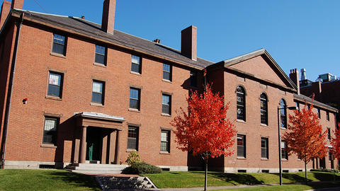 Three-story brick building seen from the street side